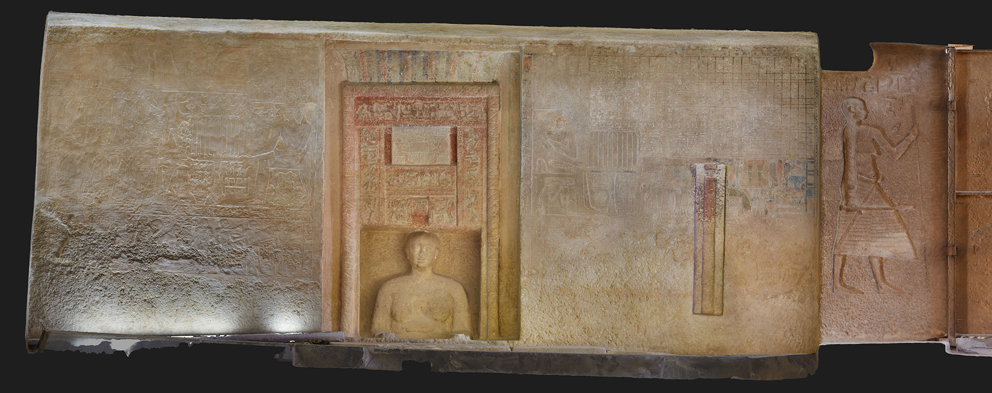 wall of idu's tomb with figure and glyphs inside false door.