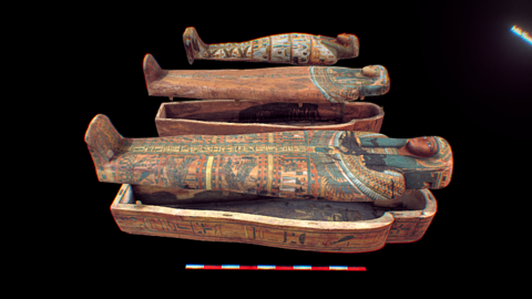 3 coffins with lids partially lifted from their bases.