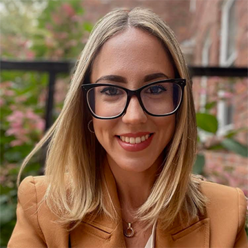Victoria Almansa-Villatoro in a tan colored jacket.