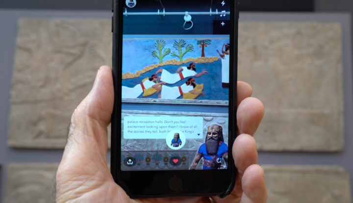 A phone displaying the Journey to Ancient Assyria Altered Reality app.