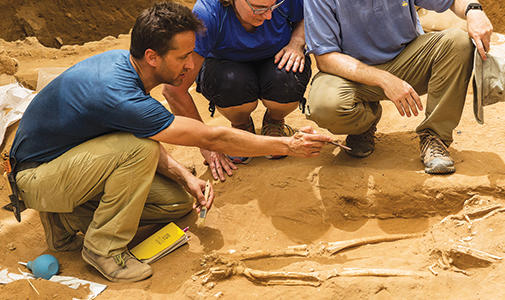 Photo of Adam J. Aja discovering a philistine cemetery