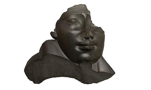 Ancient Egyptian bust with nose broken off.