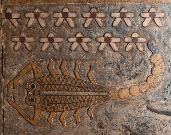 An Egyptian ceiling decoration featuring an illustration of a scorpion.