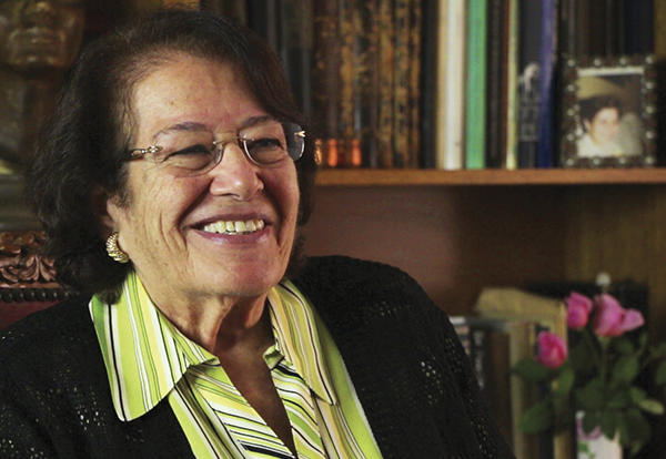 Woman, Fayza Haikal, smiling.