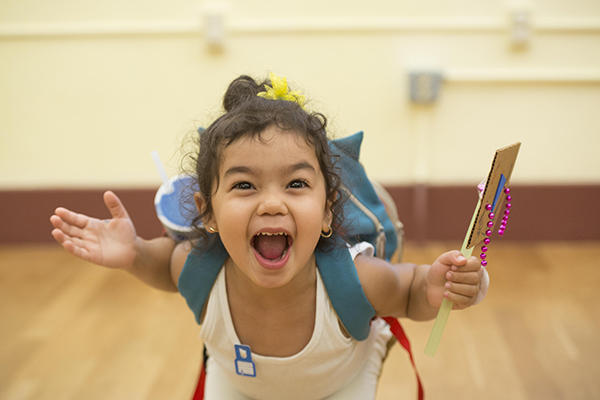 Child smiling in the museum
