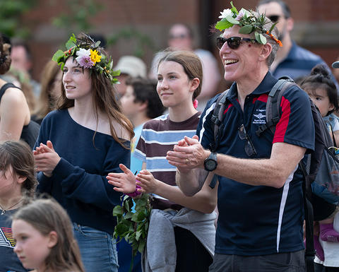 Guests at Summer Solstice wearing flower crowns.